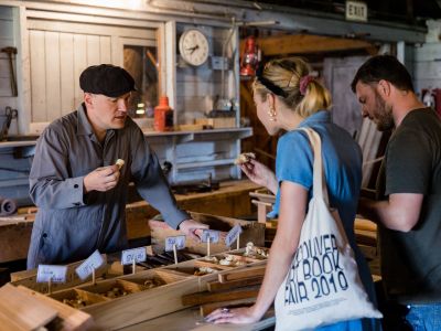 Couple learning about boatbuilding